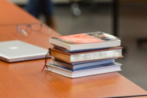 A stack of books on a desk